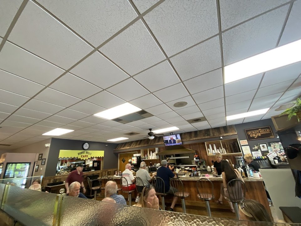 Counter seating inside a casual American restaurant